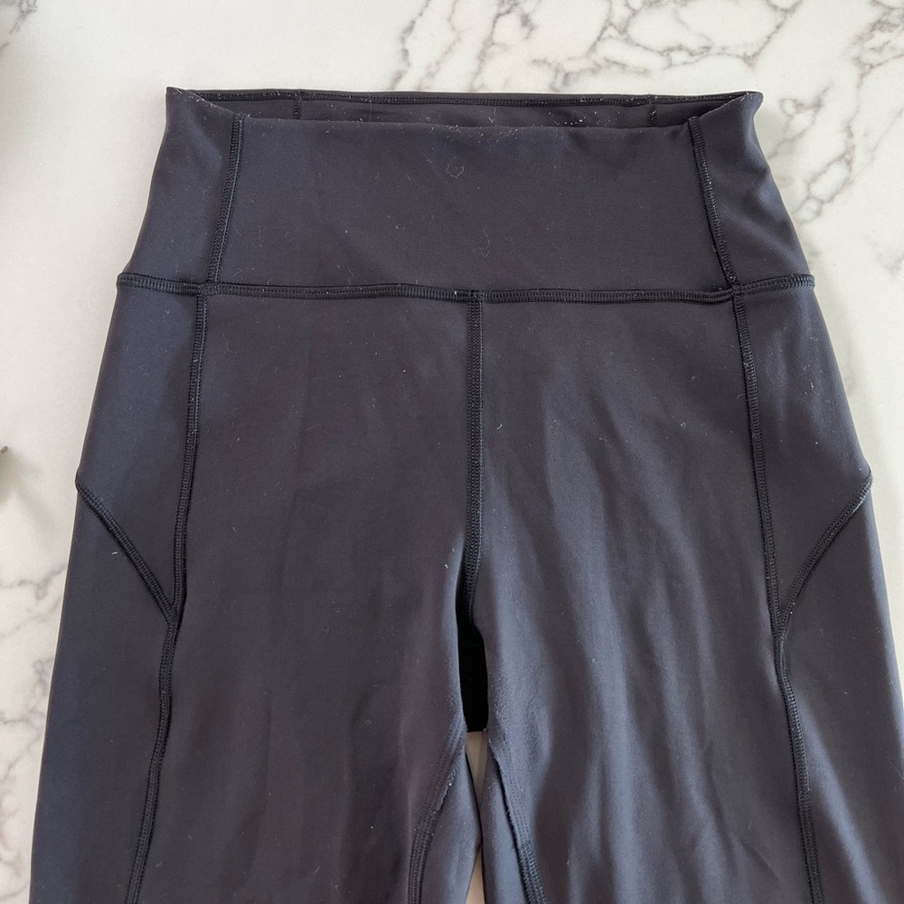 black lululemon leggings with stitching detail